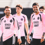 Happy Inter Miami players in team jerseys during training or match.