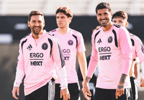 Happy Inter Miami players in team jerseys during training or match.